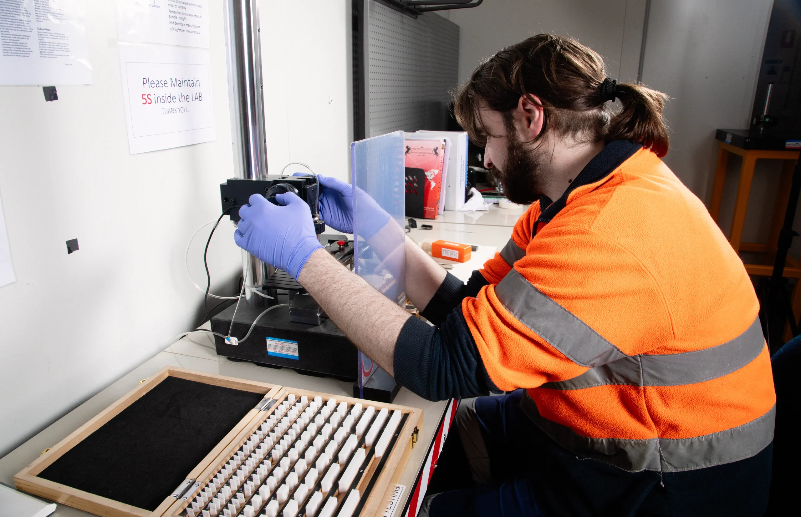 Tex At Site technician performing precision calibration on industrial test equipment during a mobile on-site calibration service in Australia.